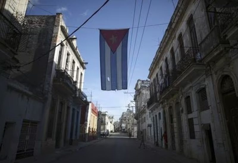 A Cuban flag hangs on the street in downtown Havana, Cuba. REUTERS/Alexandre Meneghini