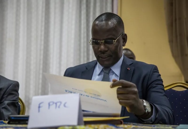 Abdoulaye Hissene, an ex-leader of the FPRC (Popular Front for the Rebirth of Central African Republic) armed group, reads a report on the breaches of the Khartoum agreements by armed groups, in Bangui, on August 23, 2019 [Florent Vergnes/AFP]