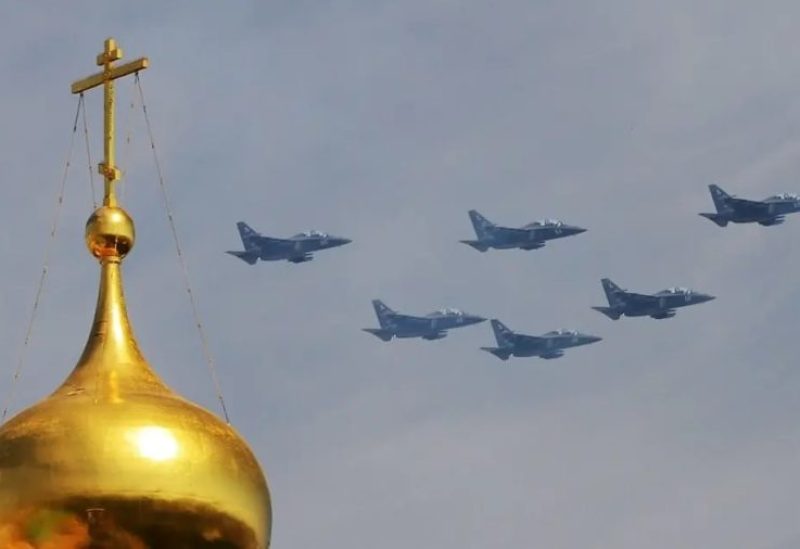 Yakovlev Yak-130 Mitten subsonic two-seat advanced jet trainers of Wings of Tavrida fly over Red Square during the Victory Day military parade in Moscow on May 9, 2015. (AFP)