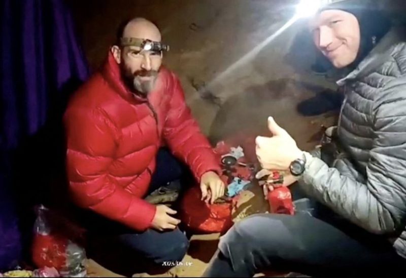 U.S. explorer Mark Dickey is seen next to a rescuer inside the Morca Cave, near Anamur in Mersin province, southern Turkey September 6, 2023