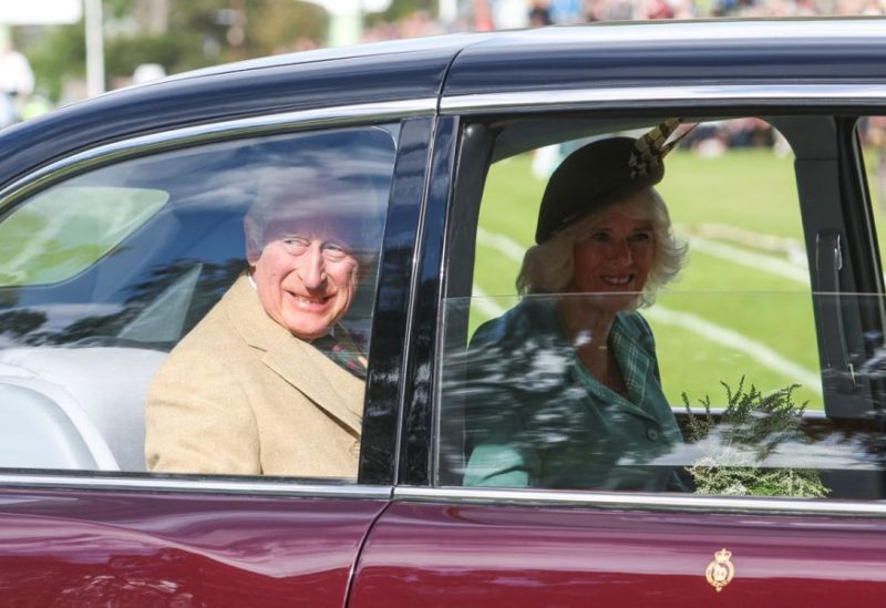 Britain's King Charles and Queen Camilla look out of a car window at the Braemar Royal Highland Gathering at the Princess Royal and Duke of Fife Memorial Park in Braemar, Scotland, Britain September 2, 2023