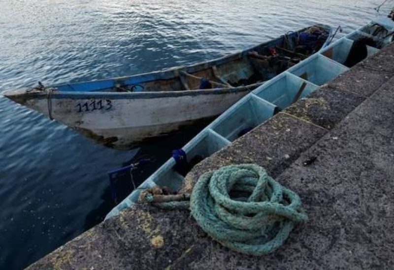 A view of a wooden boat that migrants used, to reach the Canary Islands, at the port of Arguineguin, in the island of Gran Canaria, Spain April 20, 2023. REUTERS/Borja Suarez/File Photo
