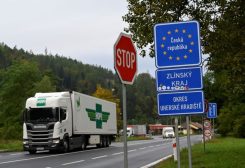 A truck passes border plaques at Czech-Slovak border, while police officers proceed to check vehicles in Stary Hrozenkov, as part of the security measures that were put in place after the numbers of migrants travelling to Germany increased, Czech Republic, September 29, 2022. REUTERS