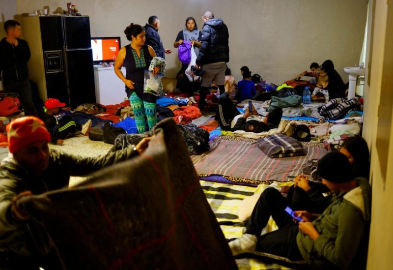 Venezuelan migrants, some expelled from the U.S. to Mexico under Title 42 and others who have not yet crossed after the new immigration policies, rest in an old warehouse that was improvised as a shelter in Ciudad Juarez, Mexico December 1, 2022. REUTERS/Jose Luis Gonzalez/File Photo