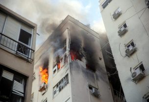 A building is ablaze following rocket attacks from the Gaza Strip, in Tel Aviv, Israel October 7, 2023. REUTERS/Itai Ron