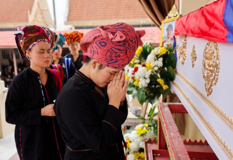 Mourners attend the cremation ceremony of Moe Myint, a 31-year-old Burmese victim of the Thailand mall shooting, at a temple in Nonthaburi, Thailand, October 8, 2023. REUTERS/Jorge Silva