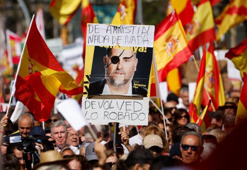 A picture of ERC's leader Oriol Junqueras is shown during a unionist protest against amnesty of separatist leaders and activists involved in the 2017 failed independence drive at Passeig de Gracia in Barcelona, Spain, October 8, 2023. REUTERS/ Albert Gea