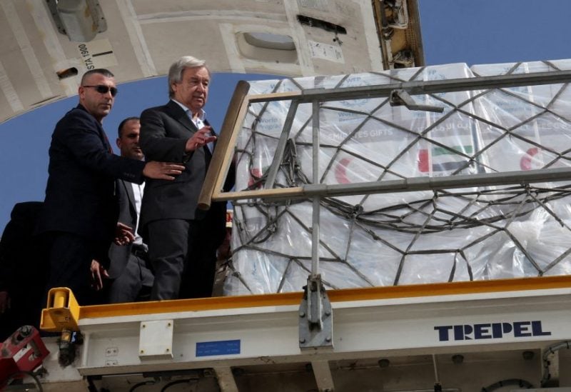 United Nations Secretary-General Antonio Guterres inspects aid for Palestinians, as officials wait to deliver aid to Gaza through the Rafah border crossing between Egypt and the Gaza Strip, amid the ongoing conflict between Israel and the Palestinian Islamist group Hamas, at Al Arish airport, in Egypt, October 20, 2023. REUTERS/Amr Abdallah Dalsh