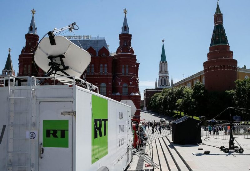 Vehicles of Russian state-controlled broadcaster Russia Today (RT) are seen near the Red Square in central Moscow, Russia June 15, 2018. Picture taken June 15, 2018. REUTERS/Gleb Garanich/File Photo