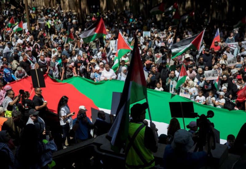 People demonstrate in support of Palestinians in Gaza as the conflict between Israel and Hamas continues, in Sydney, Australia, Saturday, October 21 2023. AAP/Brent Lewin via REUTERS