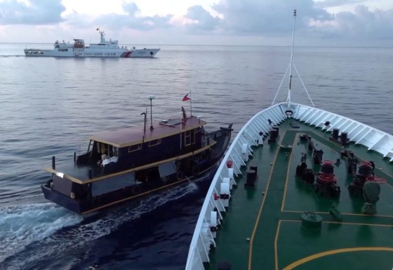 A Philippine flagged boat is blocked by a China Coast Guard vessel during an incident that resulted in a collision between the two vessels, in the disputed waters of the South China Sea in this screen grab obtained from handout video released October 22, 2023. China Coast Guard/Handout via REUTERS