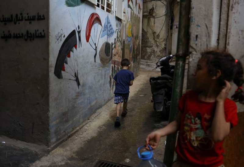 A girl stands as a boy walks in Bourj al-Barajneh Refugee Camp in Beirut, Lebanon, October 25, 2023. REUTERS/Amr Alfiky
