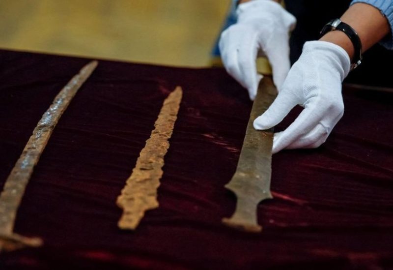 Employees of the Kyiv Pechersk Lavra National Reserve unpack returned antique Ukrainian artifacts, which were stolen by a Russian citizen and seized by the US Custom Service and Border Protection in New York, amid Russia's attack on Ukraine, in Kyiv, Ukraine, October 20, 2023.