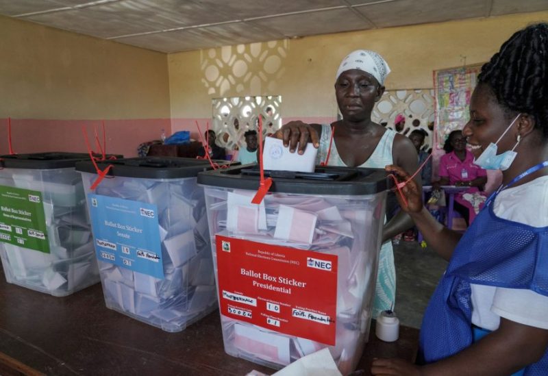 A woman casts her vote during Liberia's presidential election in Monrovia, Liberia October 10, 2023. REUTERS