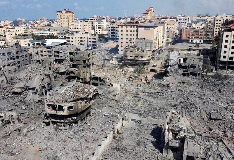 FILE PHOTO: A view shows houses and buildings destroyed by Israeli strikes in Gaza City, October 10, 2023. REUTERS/Mohammed Salem/File Photo