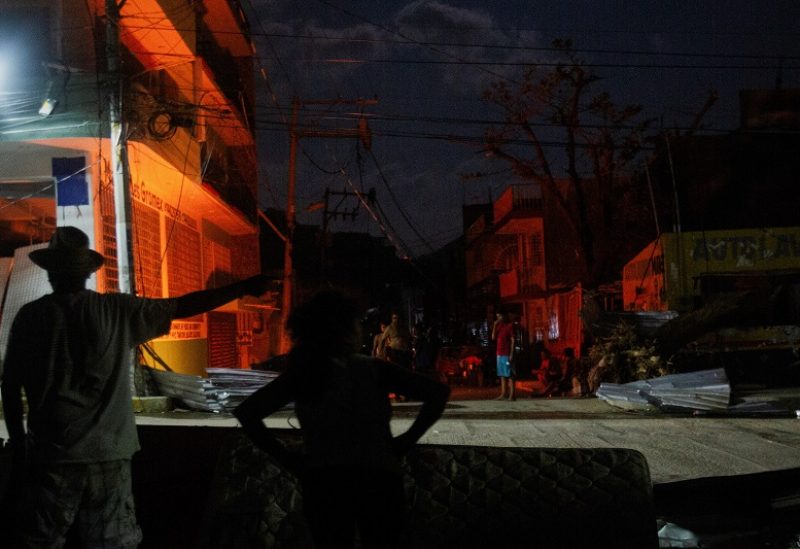 People stand guard on the streets to protect their houses from burglars, in the aftermath of Hurricane Otis, in the Progreso neighbourhood in Acapulco, Mexico, October 29, 2023. REUTERS/Quetzalli Nicte-Ha