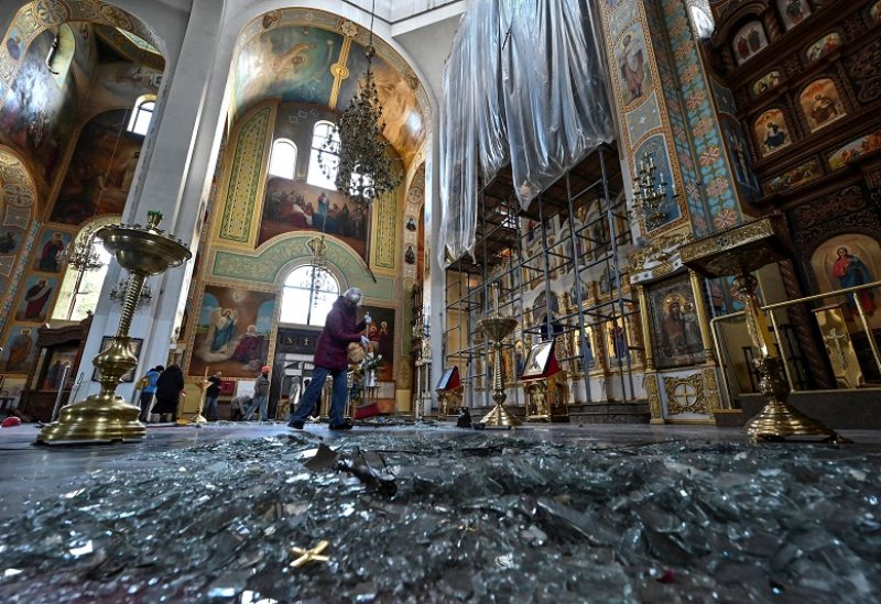 A woman removes debris inside a cathedral damaged by a Russian missile strike, amid Russia's attack on Ukraine, in Zaporizhzhia, Ukraine October 18, 2023. REUTERS/Stringer TPX IMAGES OF THE DAY