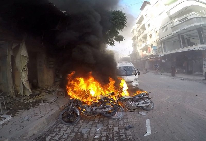 Smoke rises from vehicles set on fire, in the aftermath of strikes held by the Syrian army according to the White Helmets, in Jisr ash-Shughur, Idlib, Syria, October 5, 2023. White Helmets/Handout via REUTERS THIS IMAGE HAS BEEN SUPPLIED BY A THIRD PARTY. NO RESALES. NO ARCHIVES. MANDATORY CREDIT. MUST NOT OBSCURE LOGO