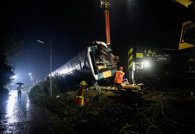Rescue workers from the Fire Service and Civil Defence work to move the derailed compartments in order to restore the rail communication after two trains collided in Bhairab, about 80 kilometres northeast of the capital Dhaka, Bangladesh, October 23, 2023. REUTERS/Piyas Biswas NO RESALES. NO ARCHIVES