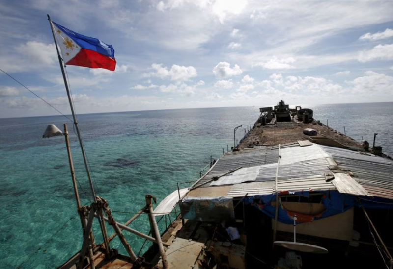 A Philippine flag flutters from BRP Sierra Madre, a dilapidated Philippine Navy ship that has been aground since 1999 and became a Philippine military detachment on the disputed Second Thomas Shoal, part of the Spratly Islands, in the South China Sea March 29, 2014.