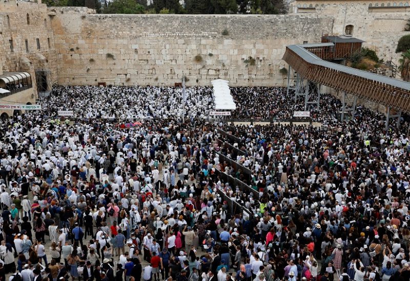 Worshippers take part in the priestly blessing during the Jewish holiday of Sukkot at the Western Wall, Judaism's holiest prayer site, in Jerusalem's Old City, October 2, 2023. REUTERS/Ammar Awad