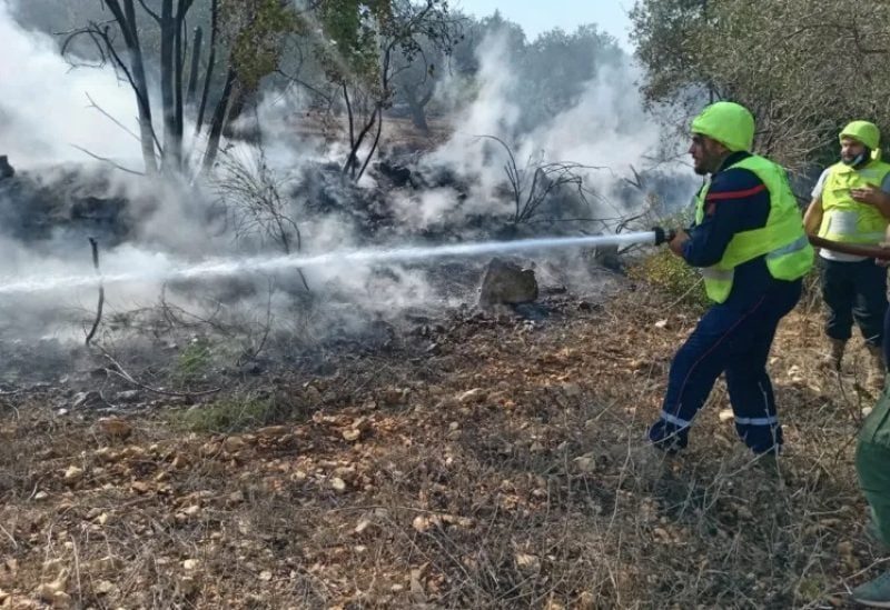 The Lebanese Civil Defense is attempting to extinguish fires in the forests and olive orchards along the Lebanese border