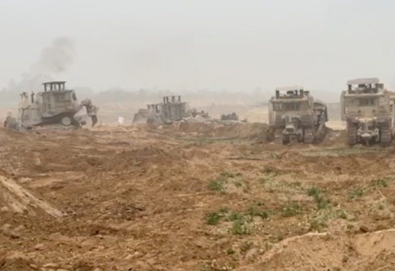 Israel Defense Forces' (IDF) armoured bulldozers are seen in a location given as Gaza, as the conflict between Israel and the Palestinian Islamist group Hamas continues, in this screengrab obtained from a handout video released on October 29, 2023. Israeli Defence Forces/Handout via REUTERS THIS IMAGE HAS BEEN SUPPLIED BY A THIRD PARTY. REUTERS WAS NOT ABLE TO INDEPENDENTLY VERIFY THE LOCATION OR THE DATE THE VIDEO WAS TAKEN.