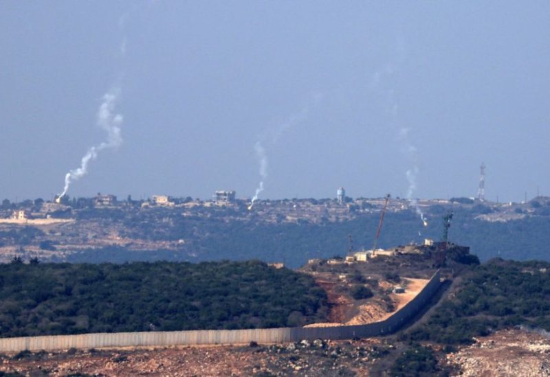 Flares are fired from northern Israel over the southern Lebanese border village of Aita al-Shaab, on October 28,2023.