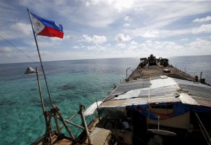 A Philippine flag flutters from BRP Sierra Madre, a dilapidated Philippine Navy ship that has been aground since 1999 and became a Philippine military detachment on the disputed Second Thomas Shoal, part of the Spratly Islands, in the South China Sea March 29, 2014. REUTERS