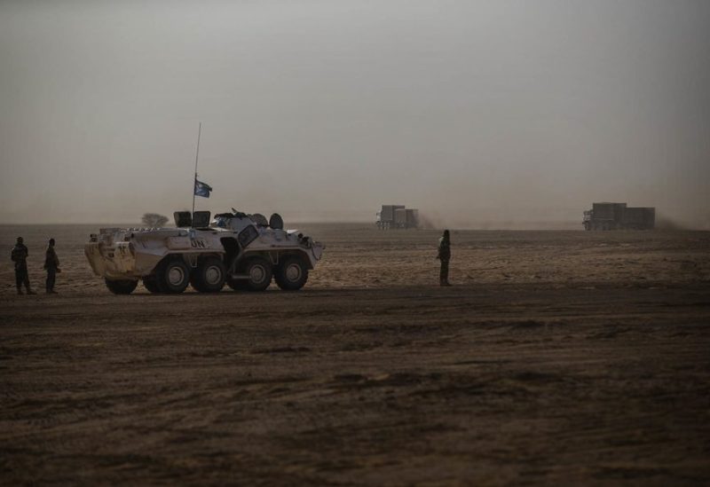 An armored vehicle escorting a MINUSMA logistic convoy from Gao to Kidal, is parked as trucks pass by, Mali February 16, 2017. Each month MINUSMA organizes logistic convoys involving hundreds of civilians and military vehicles to supply remote UN bases in northern Mali. Picture taken February 16, 2017. MINUSMA/Sylvain Liechti handout via REUTERS/File Photo