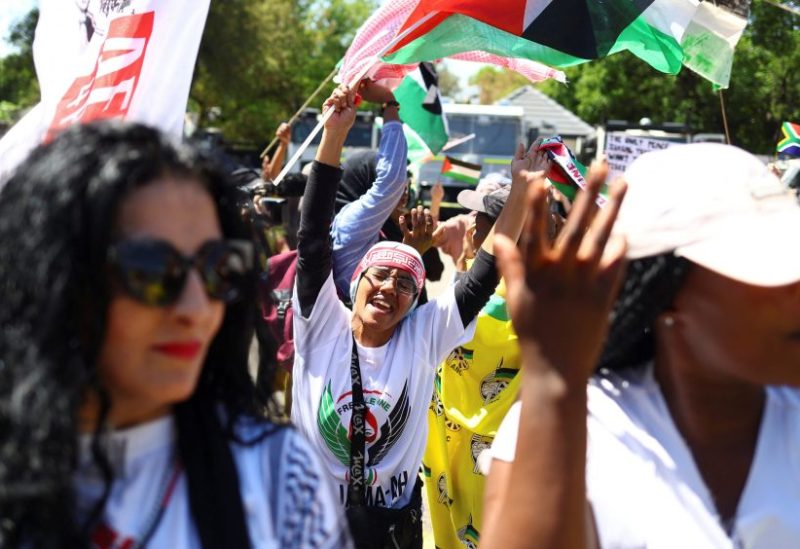 Suppoters of South Africa's ruling African National Congress (ANC) and various political parties including civil society groups gather in solidarity with the Palestinian people outside the Israeli embassy in Pretoria, south Africa, October 20, 2023. REUTERS/Siphiwe sibeko