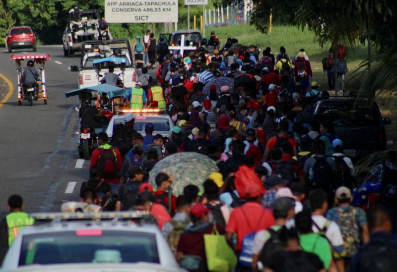 Migrants walk along the road in a caravan in an attempt to reach the U.S border, in Tapachula, Mexico November 5, 2023. REUTERS/Jose Torres
