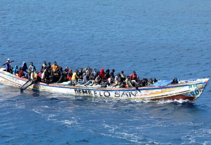 Migrants arrive on a wooden boat at the port of La Restinga on the Canary Island of El Hierro, Spain, November 9, 2023. REUTERS/Borja Suarez