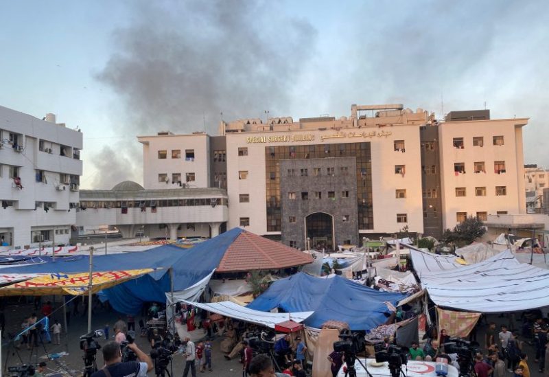 Smoke rises as displaced Palestinians take shelter at Al Shifa hospital, amid the ongoing conflict between Hamas and Israel, in Gaza City, November 8, 2023. REUTERS/Doaa Rouqa/File Photo
