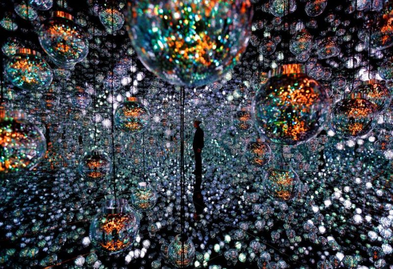 A member of the teamLab digital art group poses in an installation in preparation for the reopening of their Borderless museum in February at the Azabudai Hills complex in Tokyo, Japan November 17, 2023. REUTERS/Kim Kyung-Hoon