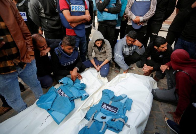 Palestinians mourn local journalists Hassouna Sleem and Sary Mansour, who were killed in an Israeli strike on a house, at a hospital in the central Gaza Strip November 19, 2023. REUTERS/Stringer