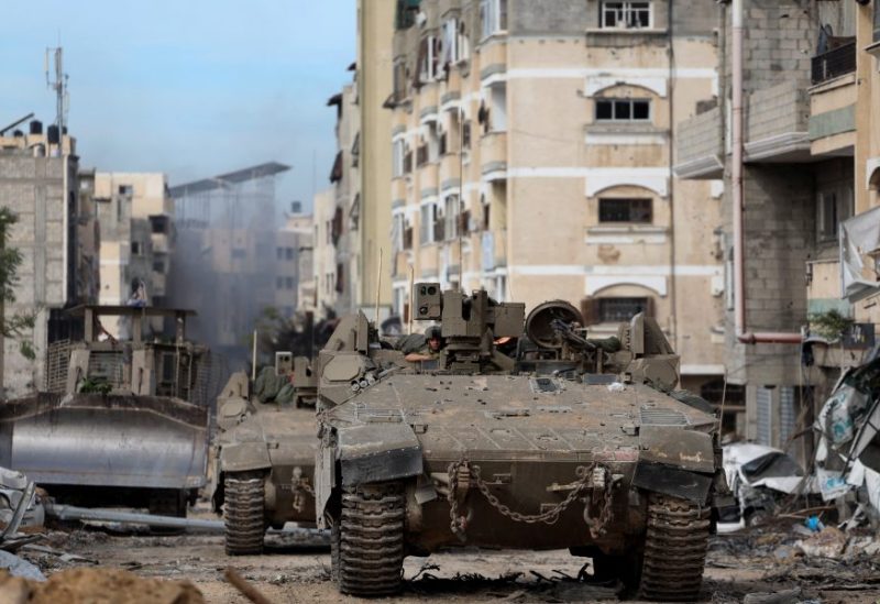 Israeli tanks operate in Gaza City, amid the ongoing ground operation of the Israeli army against Palestinian Islamist group Hamas, in the Gaza Strip, November 22, 2023. REUTERS/Ronen Zvulun