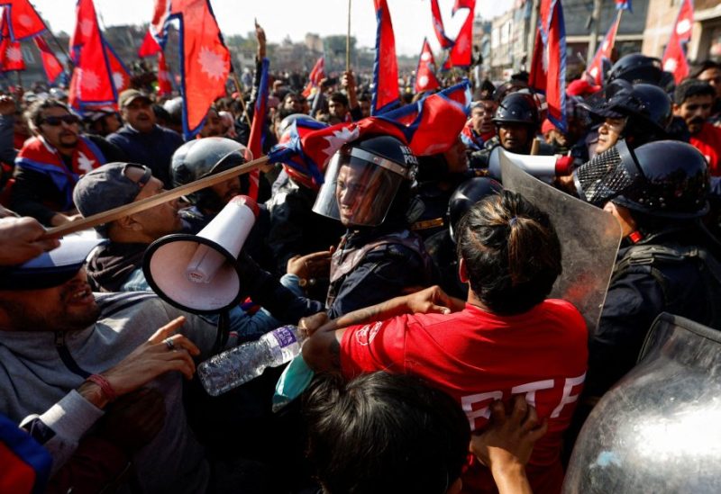 A riot police personnel gets a hit on his helmet during the clash with Pro-monarchist protesters as they protest demanding the restoration of Nepal's monarchy, which was abolished in 2008, saying the governments have failed to make any significant changes in Kathmandu, Nepal November 23, 2023. REUTERS/Navesh Chitrakar