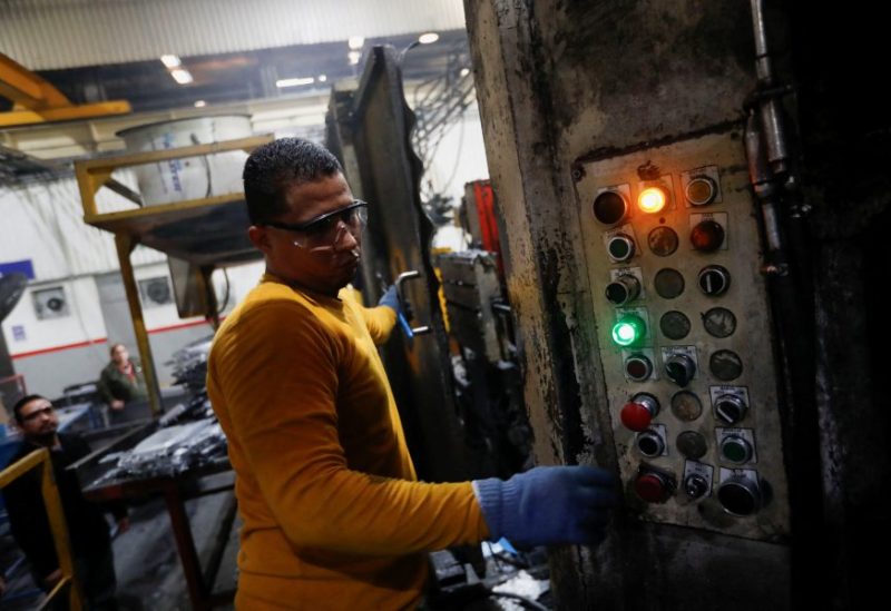 Walter Banegas, 28, originally from Honduras, works at the Pace Industries aluminum injection molding plant, his formal job after settling in Mexico as a refugee, in Saltillo, Mexico, October 16, 2023. REUTERS/Daniel Becerril