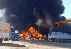 Smoke rises as a convoy of trucks burn near the Myanmar-China border, near Muse, Myanmar, in this screen grab obtained from a social media video released on November 23, 2023. Video Obtained by REUTERS
