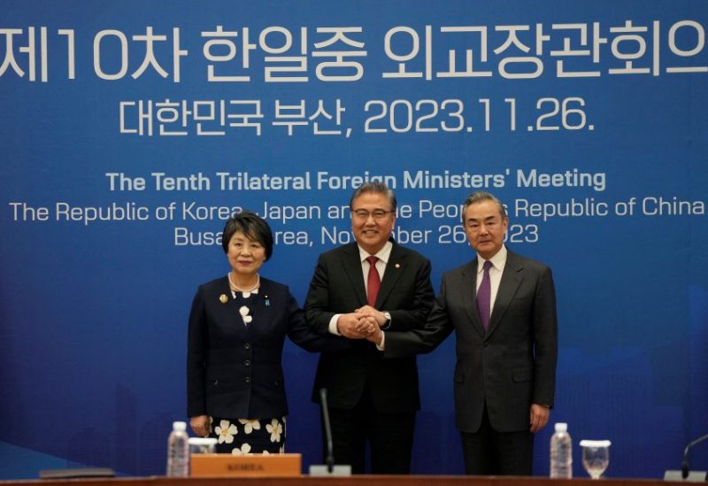Chinese Foreign Minister Wang Yi, South Korean Foreign Minister Park Jin and Japanese Foreign Minister Yoko Kamikawa pose for a photo prior to the 10th trilateral foreign ministers' meeting in Busan, South Korea, Sunday, Nov. 26, 2023. Ahn Young-joon/Pool via REUTERS