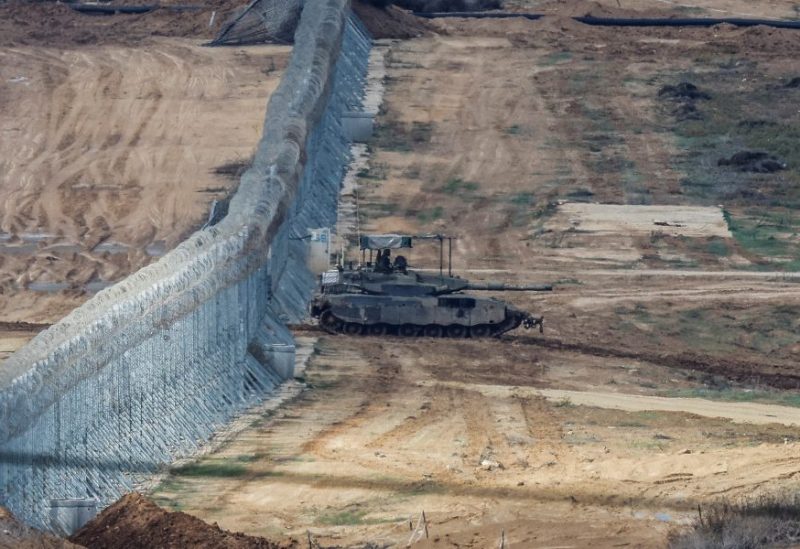 An Israeli Merkava tank manoeuvres near the Israel-Gaza border, amid the temporary truce between Hamas and Israel, as seen from southern Israel, November 28, 2023. REUTERS/Alexander Ermochenko