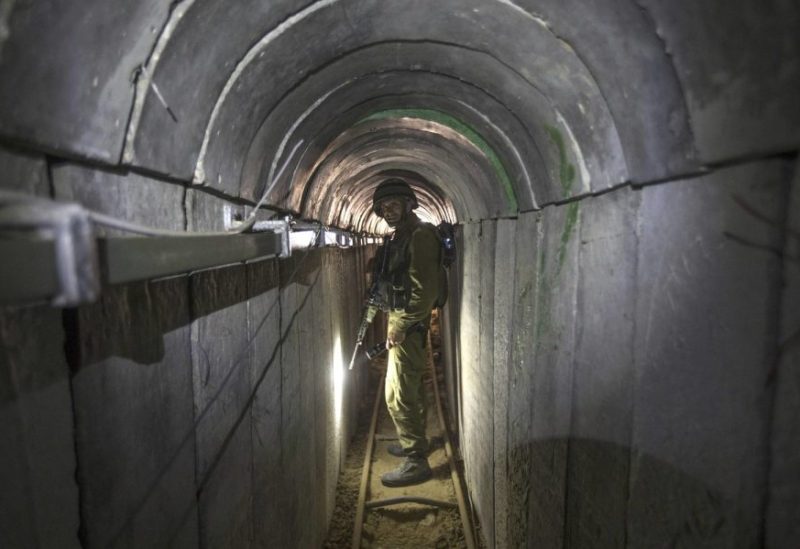 FILE - An Israeli army officer gives journalists a tour of a tunnel allegedly used by Palestinian militants for cross-border attacks, at the Israel-Gaza Border July 25, 2014. (AP Photo/Jack Guez, Pool, File)