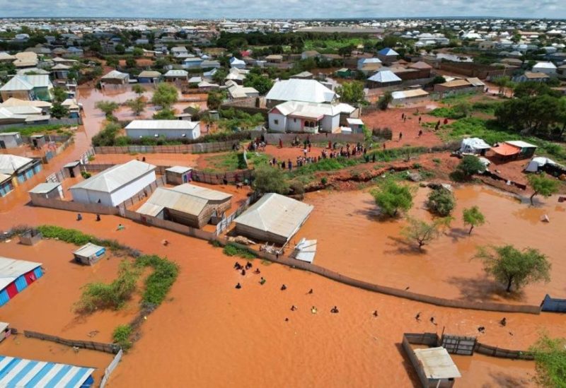 A picture taken with a drone of people walking in the flooded streets of Baidoa town, the administrative capital of Southwest State in Somalia, 06 November 2023.