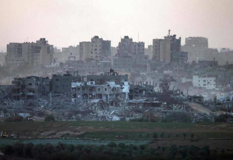 This picture taken on November 9, 2023 from a position along the border with the Gaza Strip in southern Israel, shows a view of destroyed buildings in Gaza amid ongoing battles between Israeli forces and Hamas. (Photo by Menahem KAHANA / AFP)