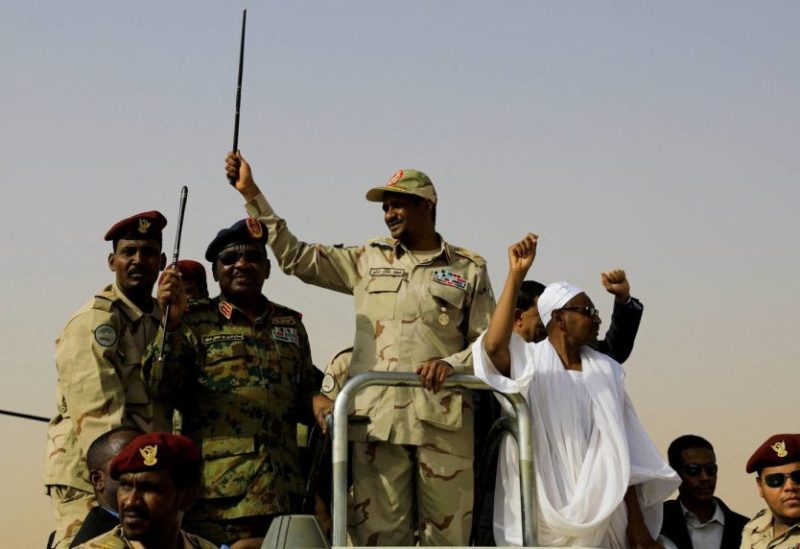 FILE PHOTO: Lieutenant General Mohamed Hamdan Dagalo, deputy head of the military council and head of paramilitary Rapid Support Forces (RSF), greets his supporters as he arrives at a meeting in Aprag village, 60 kilometers away from Khartoum, Sudan, June 22, 2019. REUTERS/Umit Bektas/File Photo