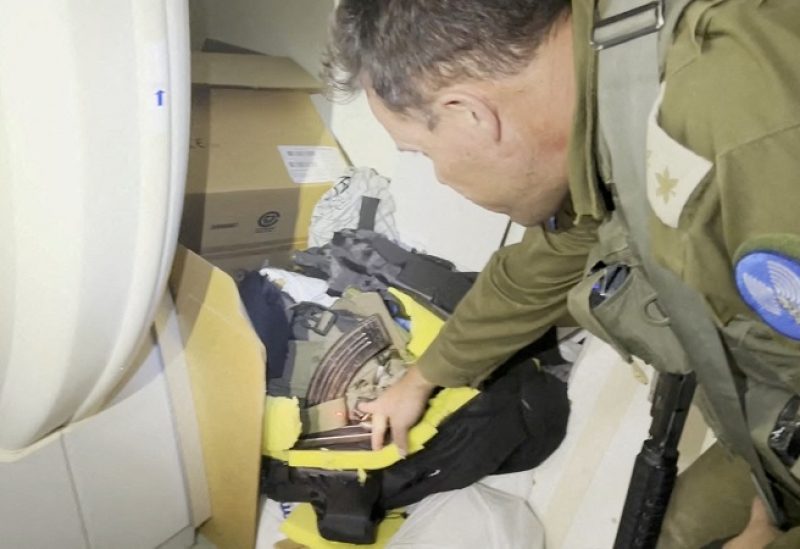 An Israeli officer points at what he describes as a grab bag containing a rifle and other munitions belonging to a Hamas fighter that was discovered behind an MRI machine at the Al Shifa hospital complex, amid the Israeli military's ground operation against Palestinian Islamist group Hamas, in Gaza City, November 15, 2023 in this still image taken from video. Israeli forces said the "beating heart" of the Hamas fighters' operations was headquartered in tunnels beneath the hospital. Hamas denied the accusation and on Wednesday dismissed the Israeli statements as "lies and cheap propaganda." Israel Defense Forces/Handout via REUTERS THIS IMAGE HAS BEEN SUPPLIED BY A THIRD PARTY.