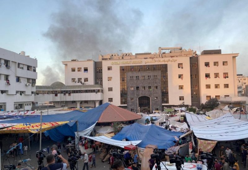 Smoke rises as displaced Palestinians take shelter at Al Shifa hospital, amid the ongoing conflict between Hamas and Israel, in Gaza City, November 8, 2023