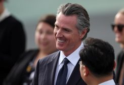 California Governor Gavin Newsom smiles as he waits for the arrival of Chinese President Xi Jinping at San Francisco International Airport to attend the APEC (Asia-Pacific Economic Cooperation) Summit in San Francisco, California, U.S., November 14, 2023. REUTERS/Brittany Hosea-Small