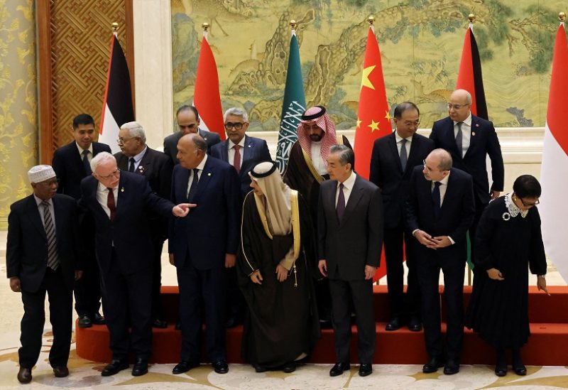 Chinese Foreign Minister Wang Yi attends a family photo session with Saudi Foreign Minister Prince Faisal bin Farhan Al Saud, Jordanian Deputy Prime Minister and Foreign Minister Ayman Safadi, Egyptian Foreign Minister Sameh Shoukry, Indonesian Foreign Minister Retno Marsudi, Palestinian Foreign Minister Riyad Al-Maliki and Organisation of Islamic Cooperation (OIC) Secretary-General Hissein Brahim Taha at the Diaoyutai State Guesthouse in Beijing, China November 20, 2023. REUTERS/Florence Lo/Pool
